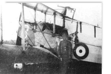 Photo of Muller standing by Thompson's downed plane.